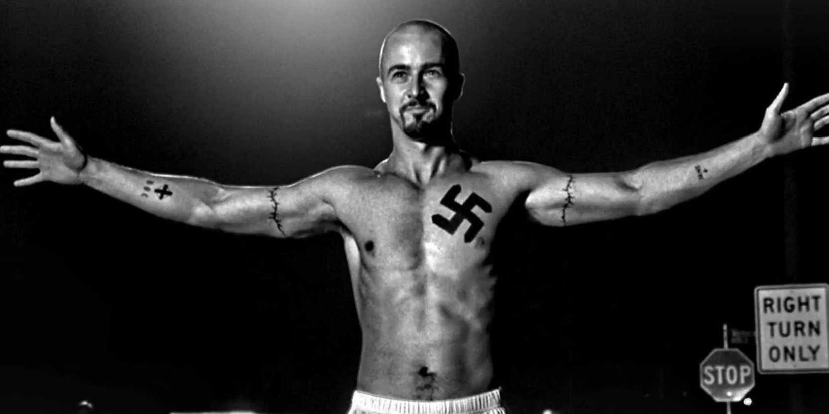 A shirtless Derek Vinyard spreading his arms in 'American History X'