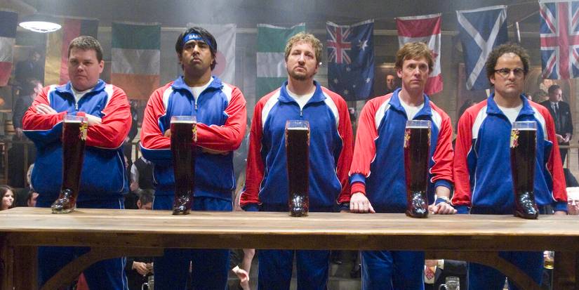 Men standing behind a table in Beerfest.