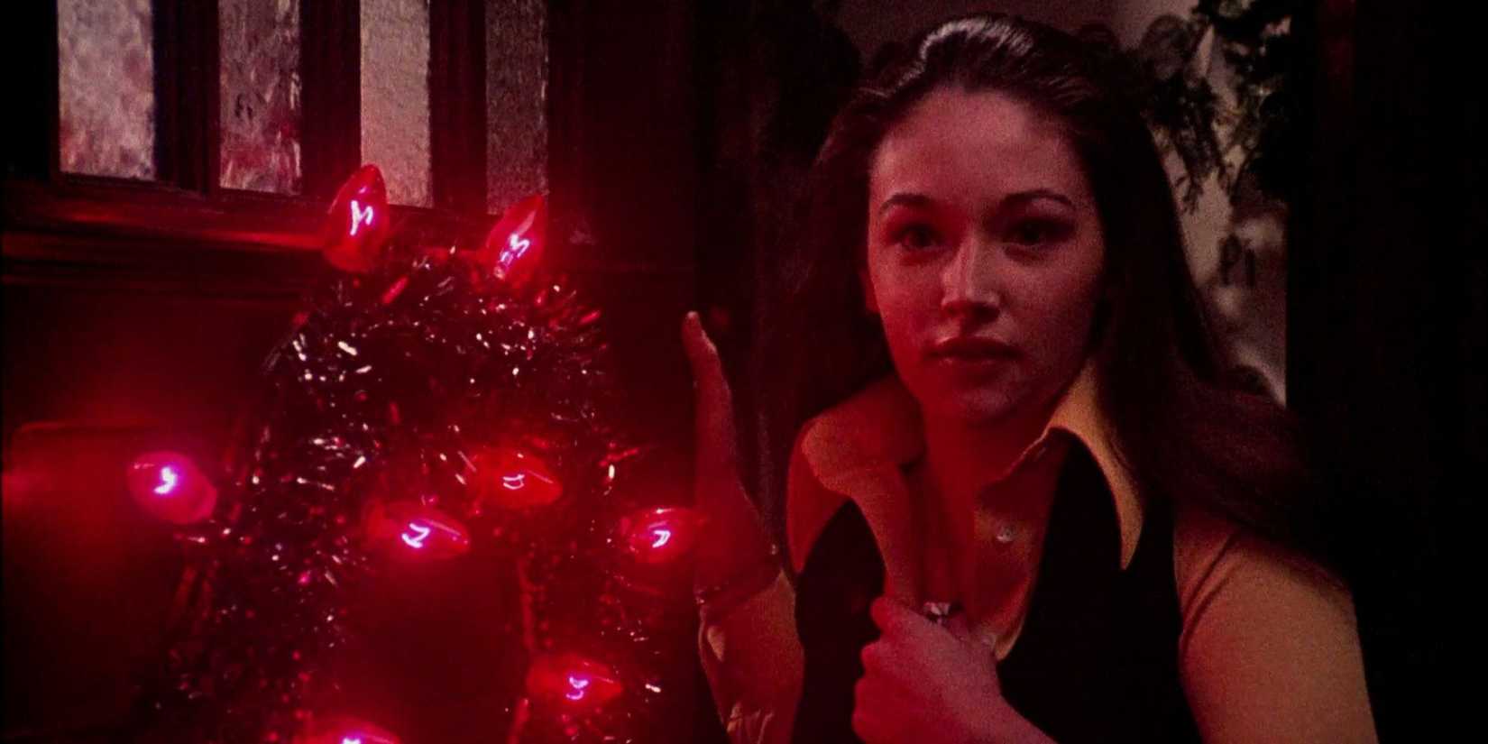 Jess (Olivia Hussey) opens the front door of a house in 'Black Christmas'