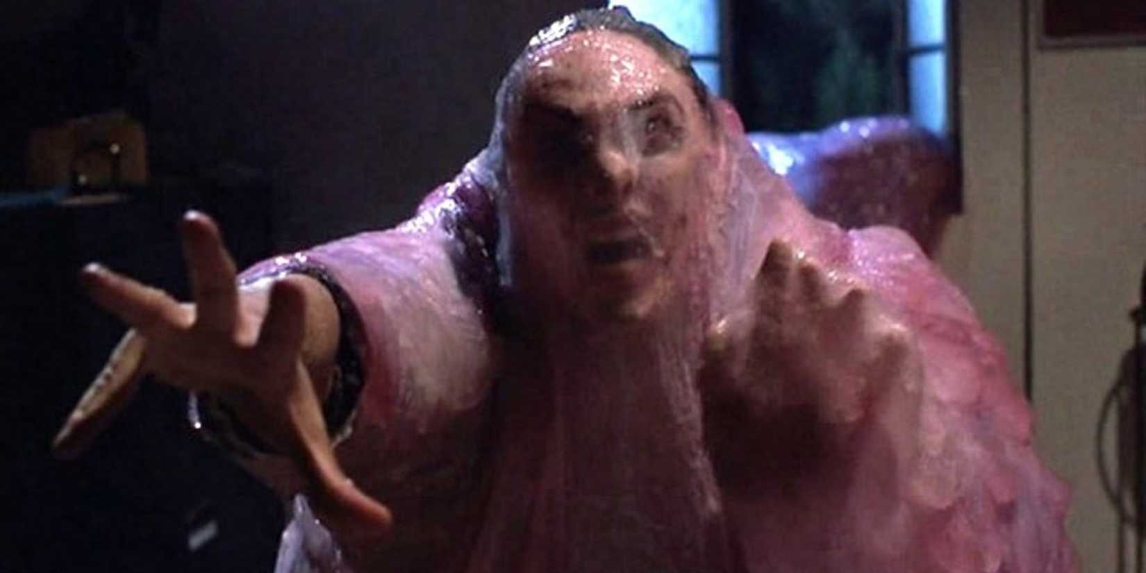 screaming man covered in a thick pink goo