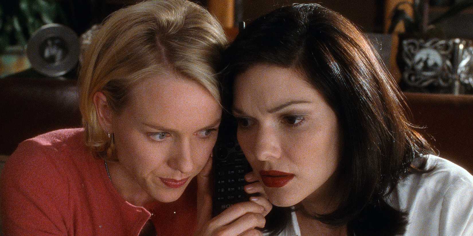 Naomi Watts as Betty and Laura Harring as Rita listening on a phone in Mulholland Drive