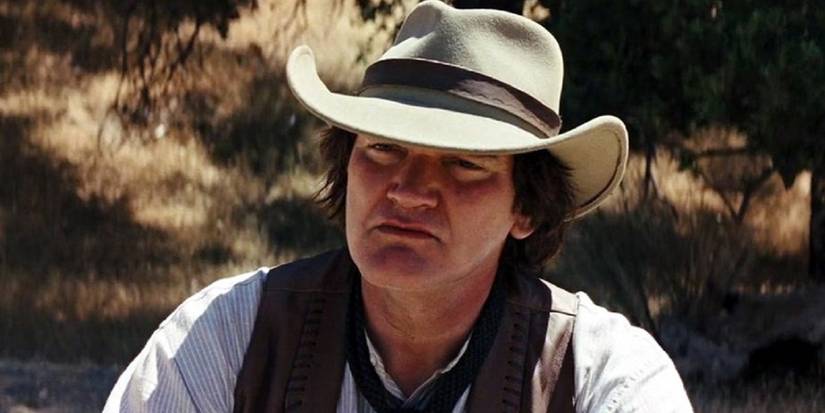 Quentin Tarantino in the desert looking intently in Django Unchained