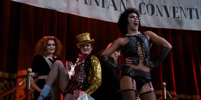 Frank N' Furter performing on stage next to Columbia and Magenta in Rocky Horror Picture Show