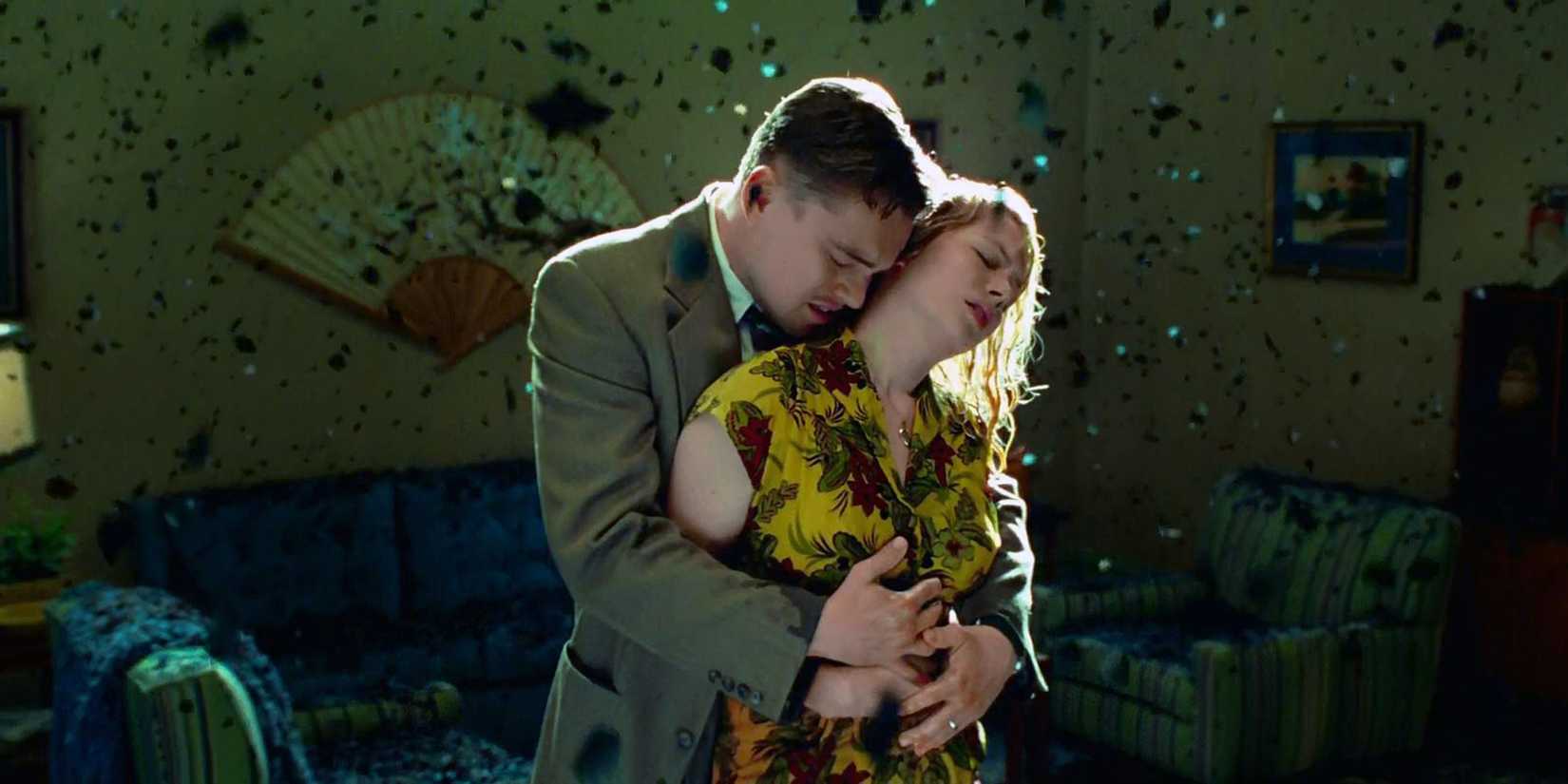 Leonardo DiCaprio holding Michelle Williams from behind in Shutter Island