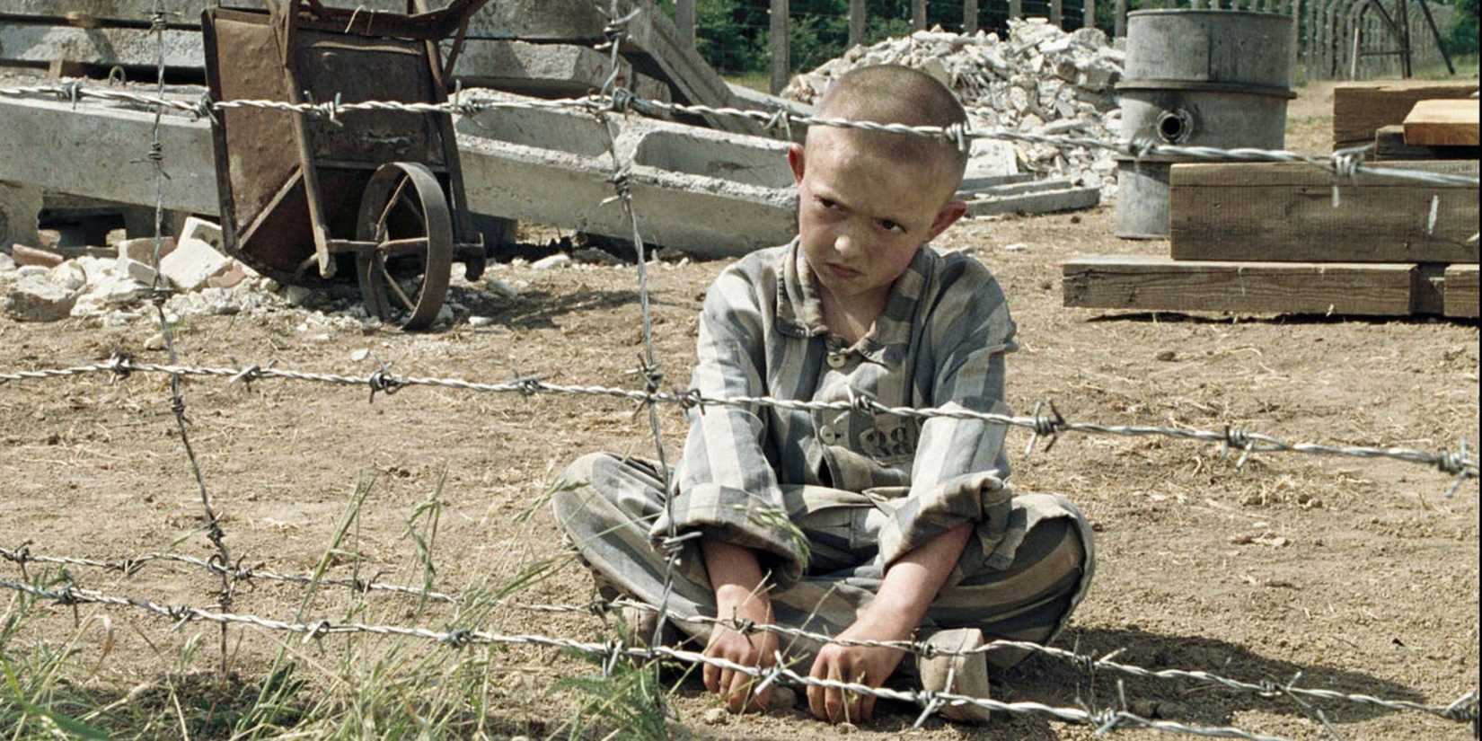The kid in The Boy In The Striped Pajamas sitting on the floor.