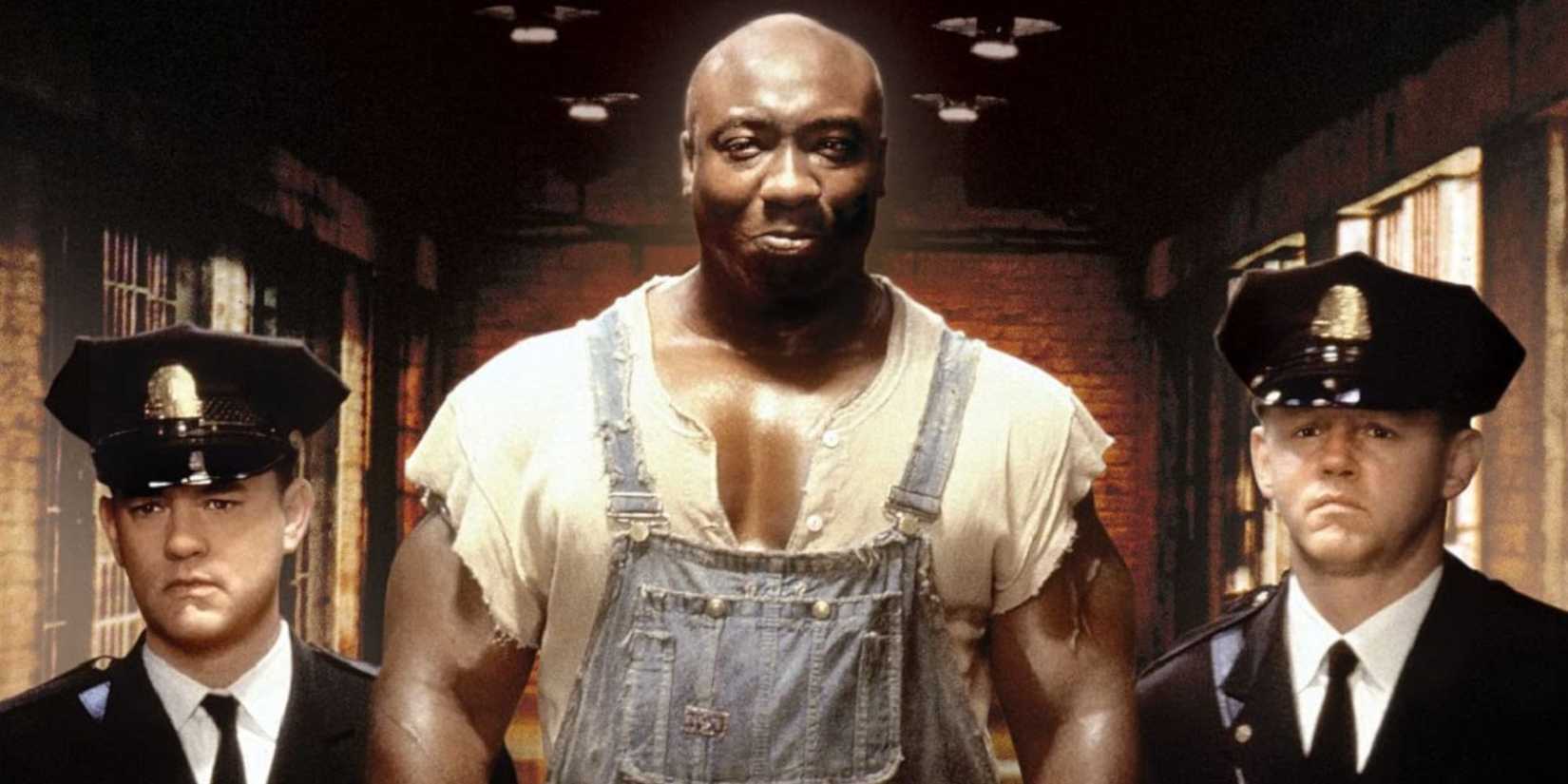 Michael Clarke Duncan as John Coffey being led down a hallway with a guard on either side in The Green Mile.