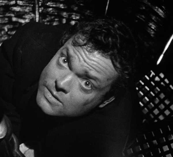 Harry Lime looking up with a scared expression in The Third Man.