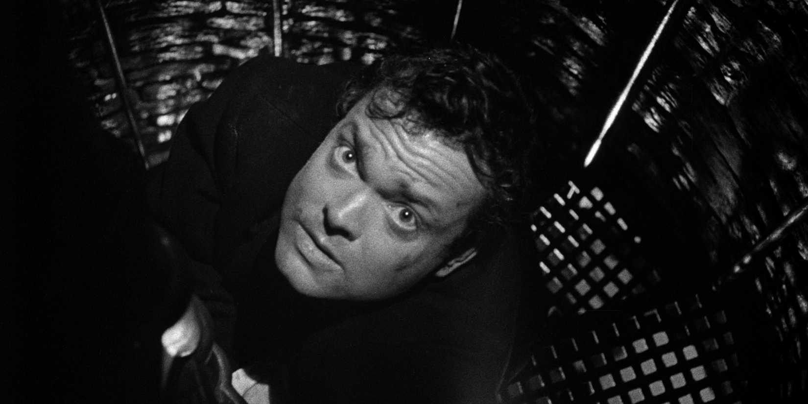Harry Lime looking up with a scared expression in The Third Man.
