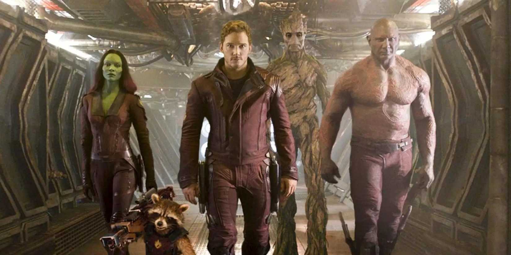 The guardians in their red uniform walking down a hallway in 'Guardians of the Galaxy'
