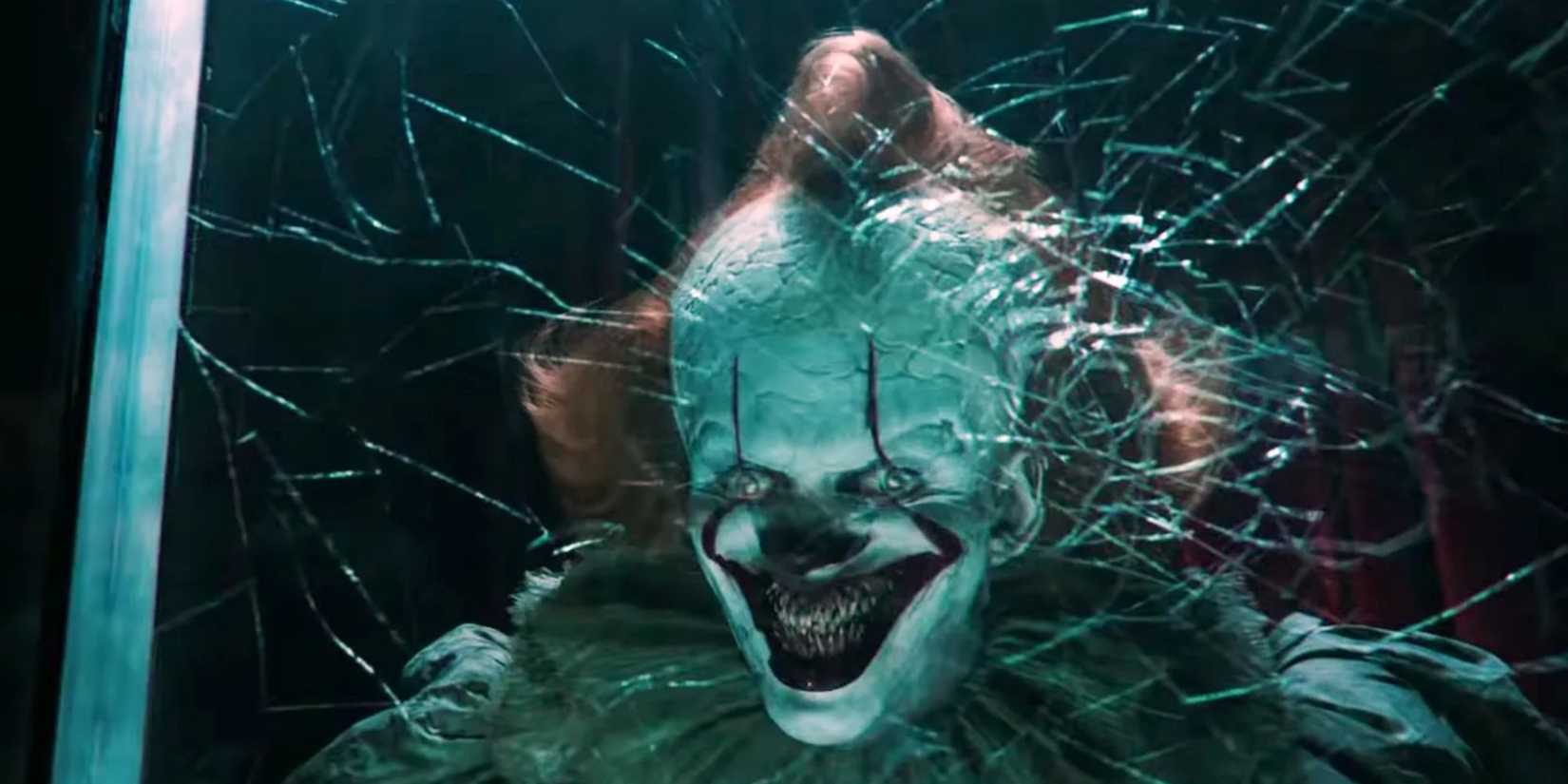 Pennywise flashing a wicked grin in IT.