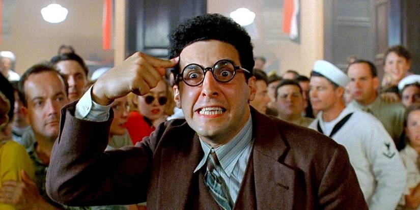 John Turturro as Barton Fink acting out in the middle of a crowd in Barton Fink