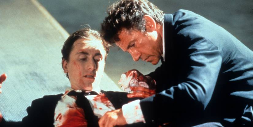 Harvey Keitel cleaning up Tim Roth's bloody wound in Reservoir Dogs