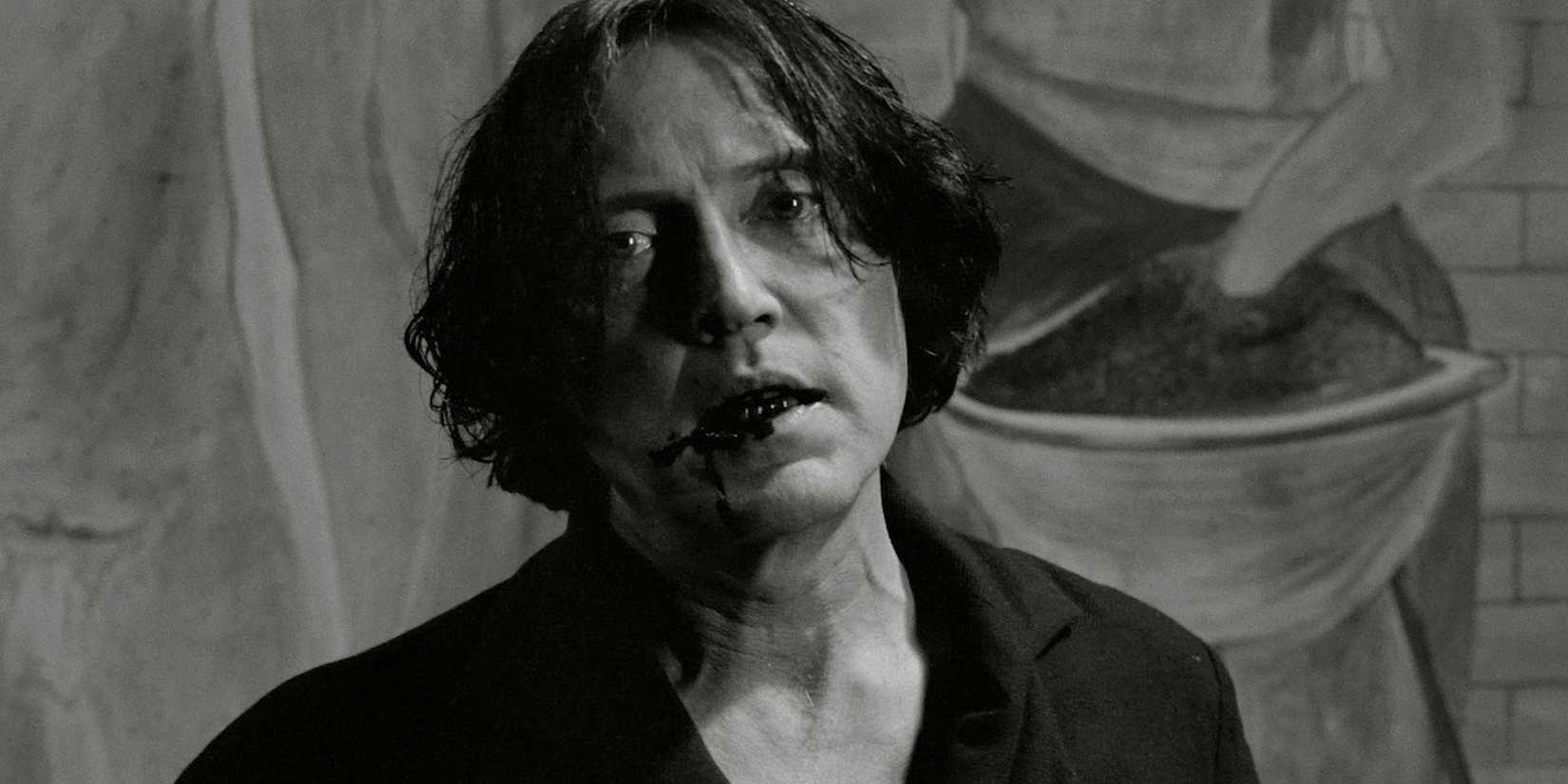 Christopher Walken has blood on the corner of his mouth in The Addiction.
