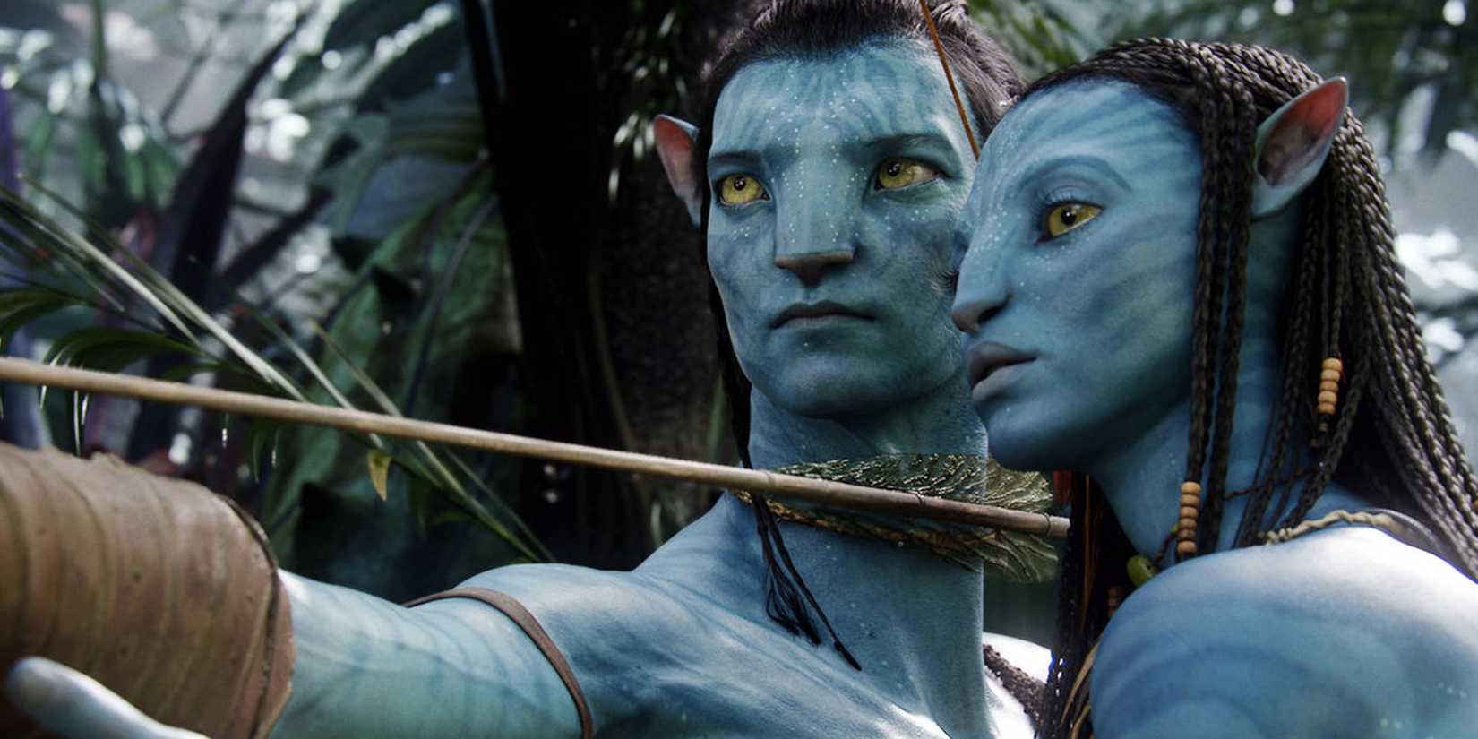 Sam Worthington as Jake Sully holding a bow and arrow next to Zoe Saldaña as Neytiri in Avatar.