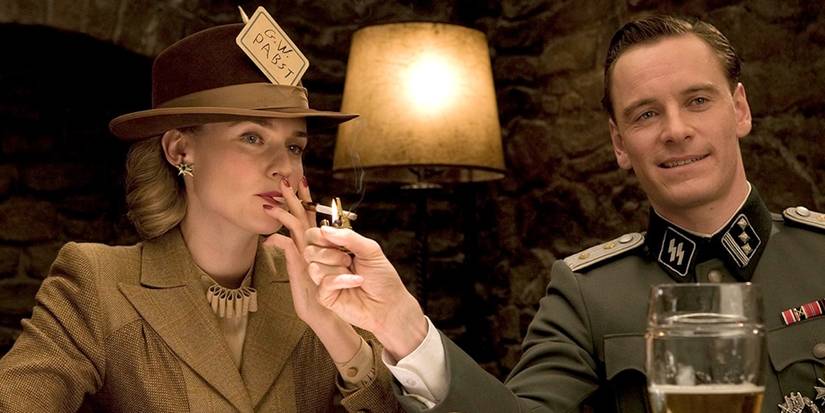 Michael Fassbender lighting Diane Kruger's cigarette while in a tavern in Inglourious Basterds