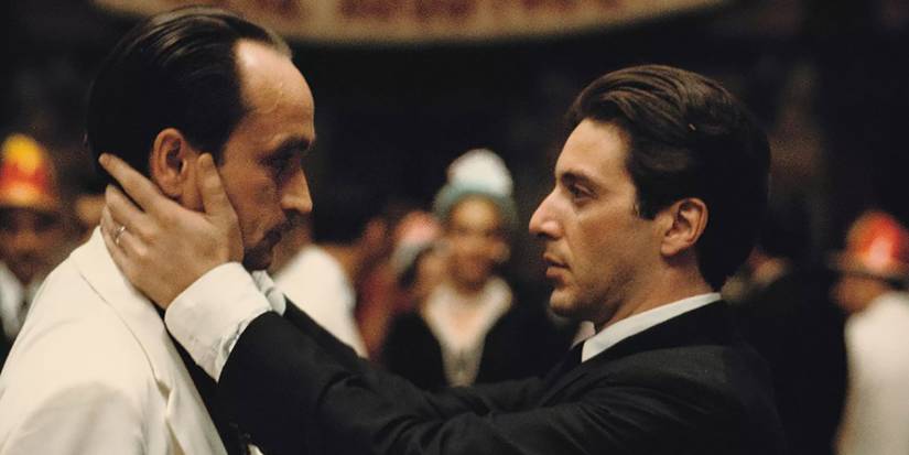 Michael Corleone (Al Pacino), grabbing Fredo's (John Cazale) face in the iconic Fredo kiss scene in The Godfather II