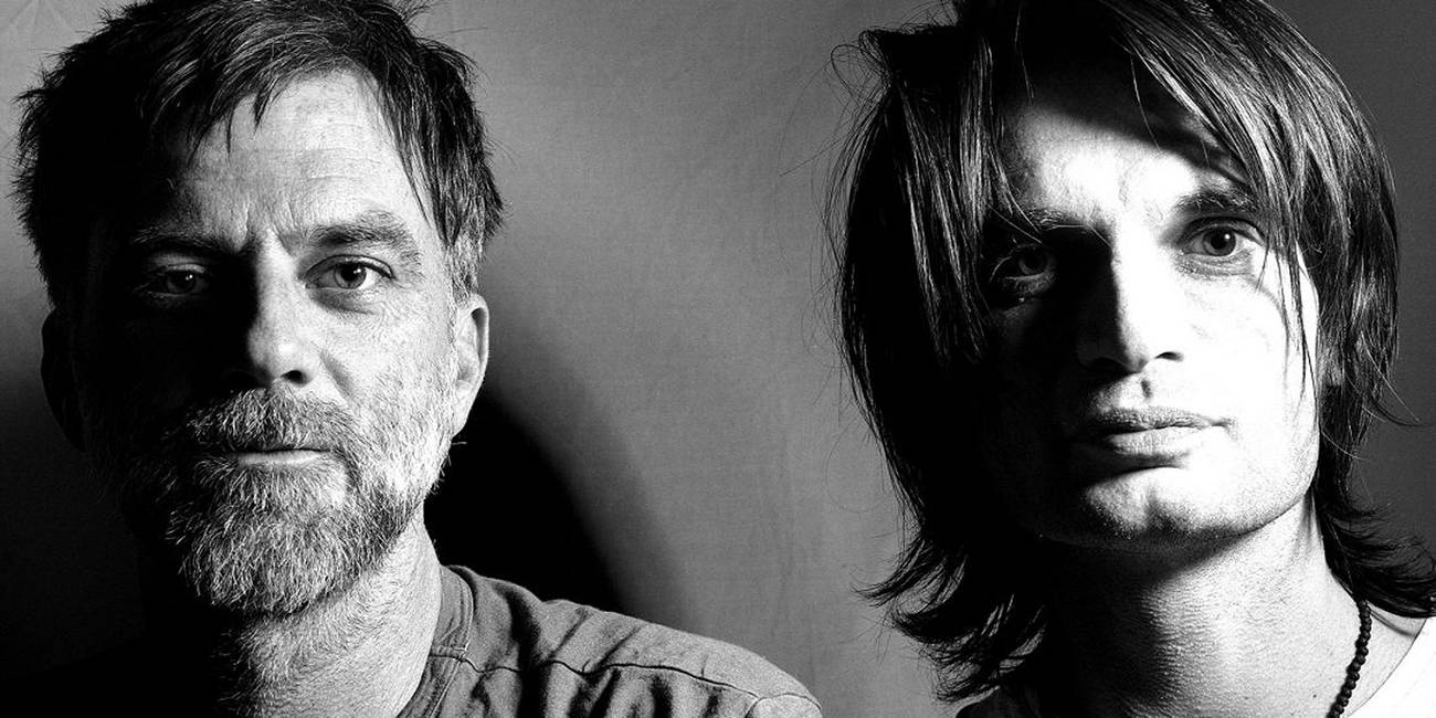 Paul Thomas Anderson and Jonny Greenwood side by side, in black and white