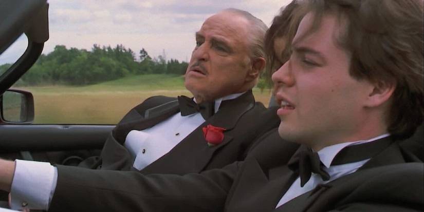 Marlon Brando and Matthew Broderick wearing tuxedos and driving in a car in The Freshman