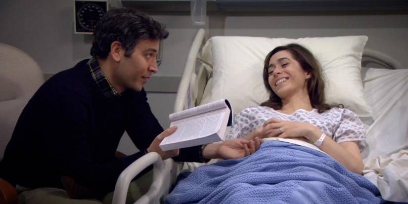 Josh Radnor's Ted sitting and reading bedside to Cristin Milioti's Tracy, who is laying in a hospital bed in How I Met Your Mother