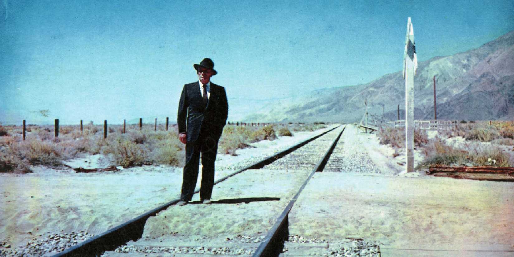 Spencer Tracy walks on railroad track in Bad Day at Black Rock