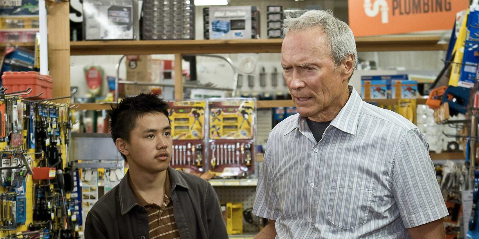 Bee Vang and Clint Eastwood standing in a hardware store in Gran Torino