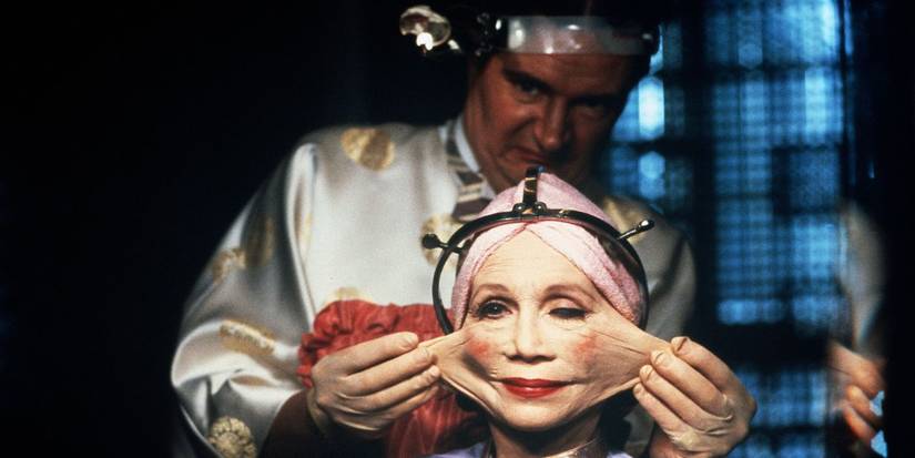Jim Broadbent stretches Katherine Helmond's face in Brazil