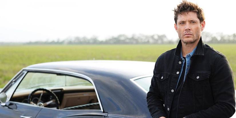 Jensen Ackles as Dean Winchester, leaning on the impala in the premiere episode of The Winchesters