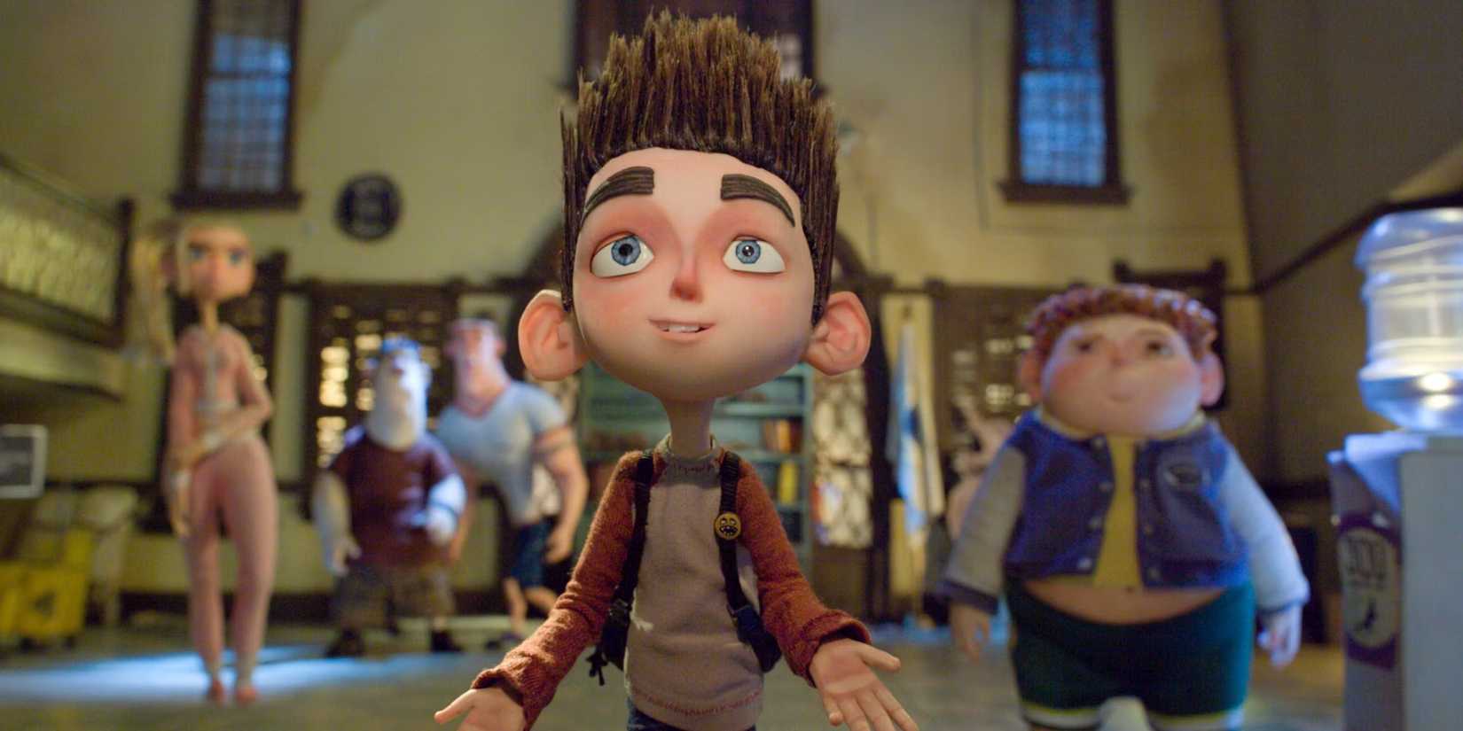 Norman and his friends looking ahead with awed expressions in 'ParaNorman'
