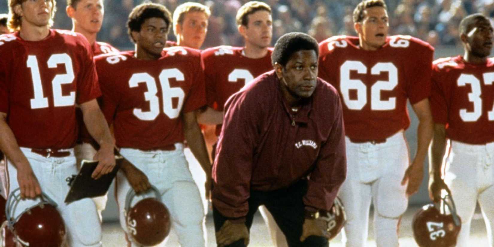 Denzel Washington as Coach Herman Boone standing in from of his football team in Remember the Titans
