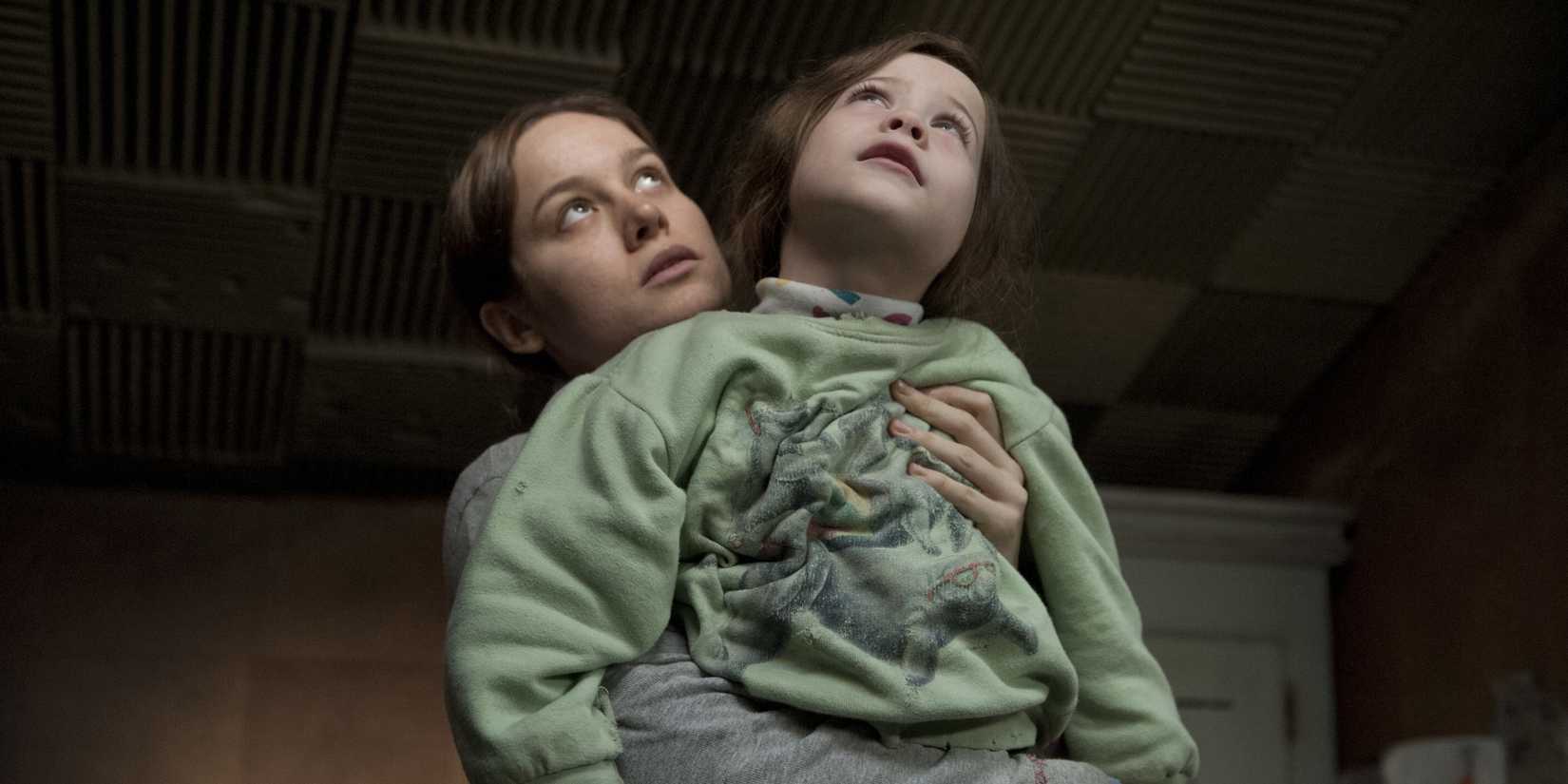 Ma holding Jack as they both look up in Room