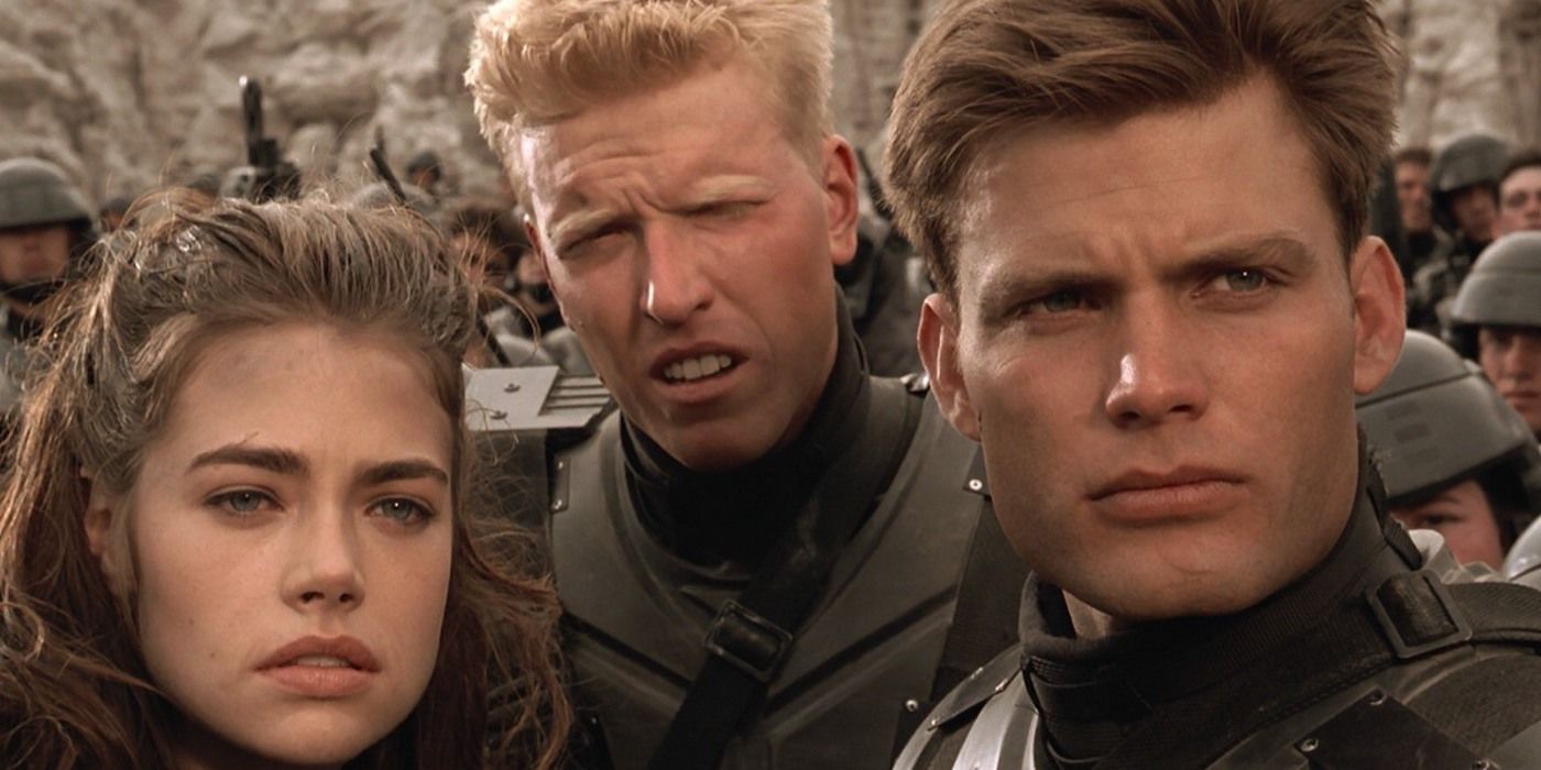 Carmen (Denise Richards), Ace (Jake Busey) and Rico (Casper Van Dien) looking stern in Starship Troopers