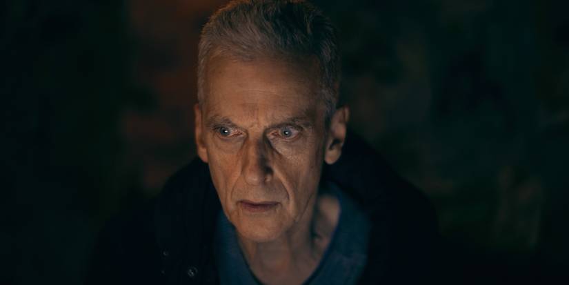 A man staring maniacally in the dark in The Devil's Hour.