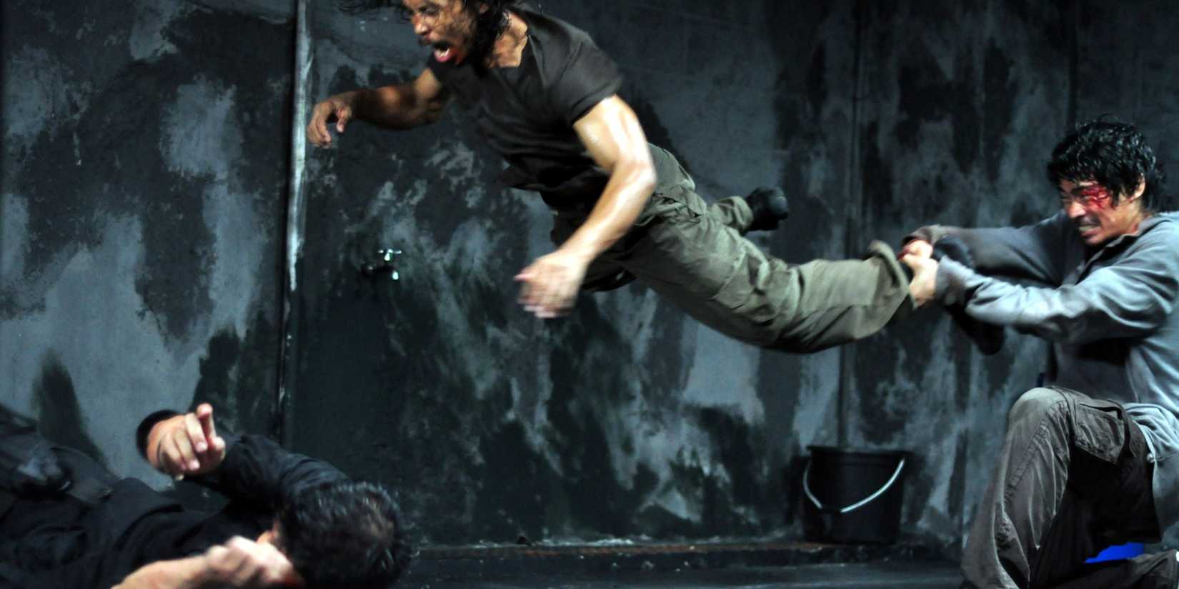 Iko Uwais, Yayan Ruhian, and Donny Alamsyah fighting in The Raid