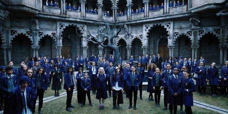 All the Nevermore students standing outside the school in their uniforms in Netflix's 'Wednesday'