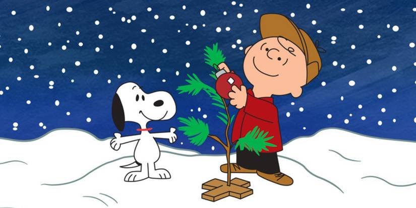 Charlie Brown and Snoopy hanging a red ornament on a wimpy tree in A Charlie Brown Christmas.