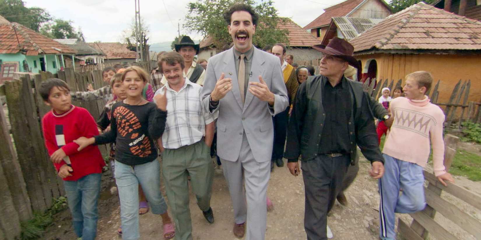 Borat walks through the streets of a Kazakhstani town. 