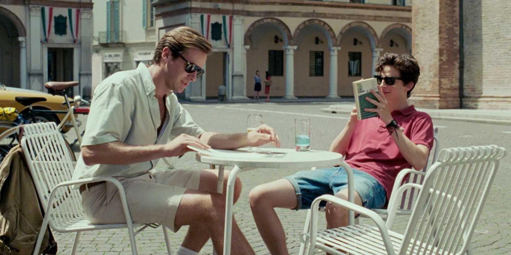 Timothée Chalamet and Armie Hammer sitting in a coffee terrace in Call Me by Your Name