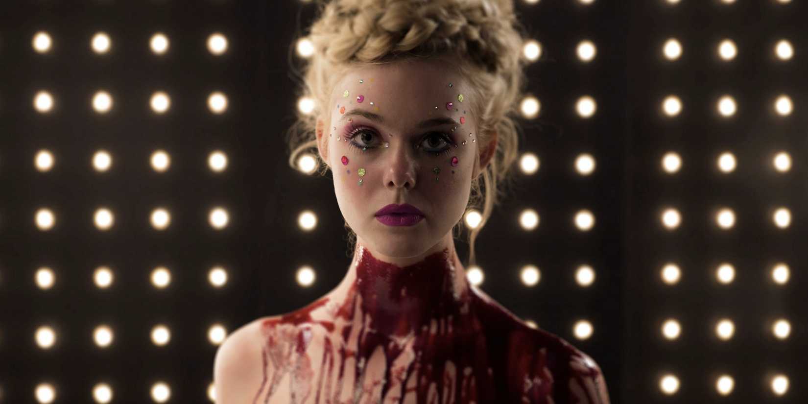 Jesse covered in blood looking at the camera in 'The Neon Demon'