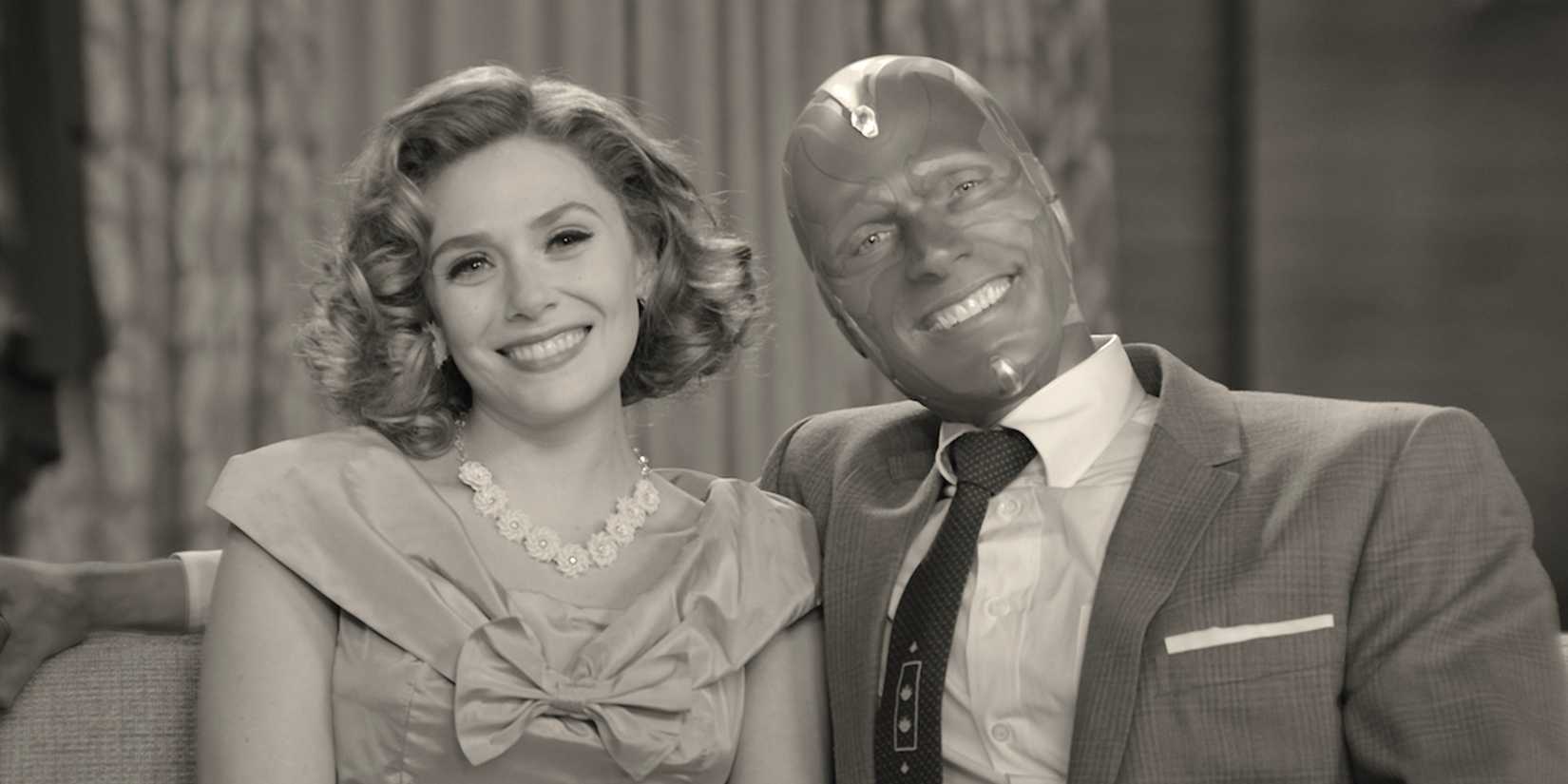 Elizabeth Olsen and Paul Bettany smile in black and white in WandaVision.