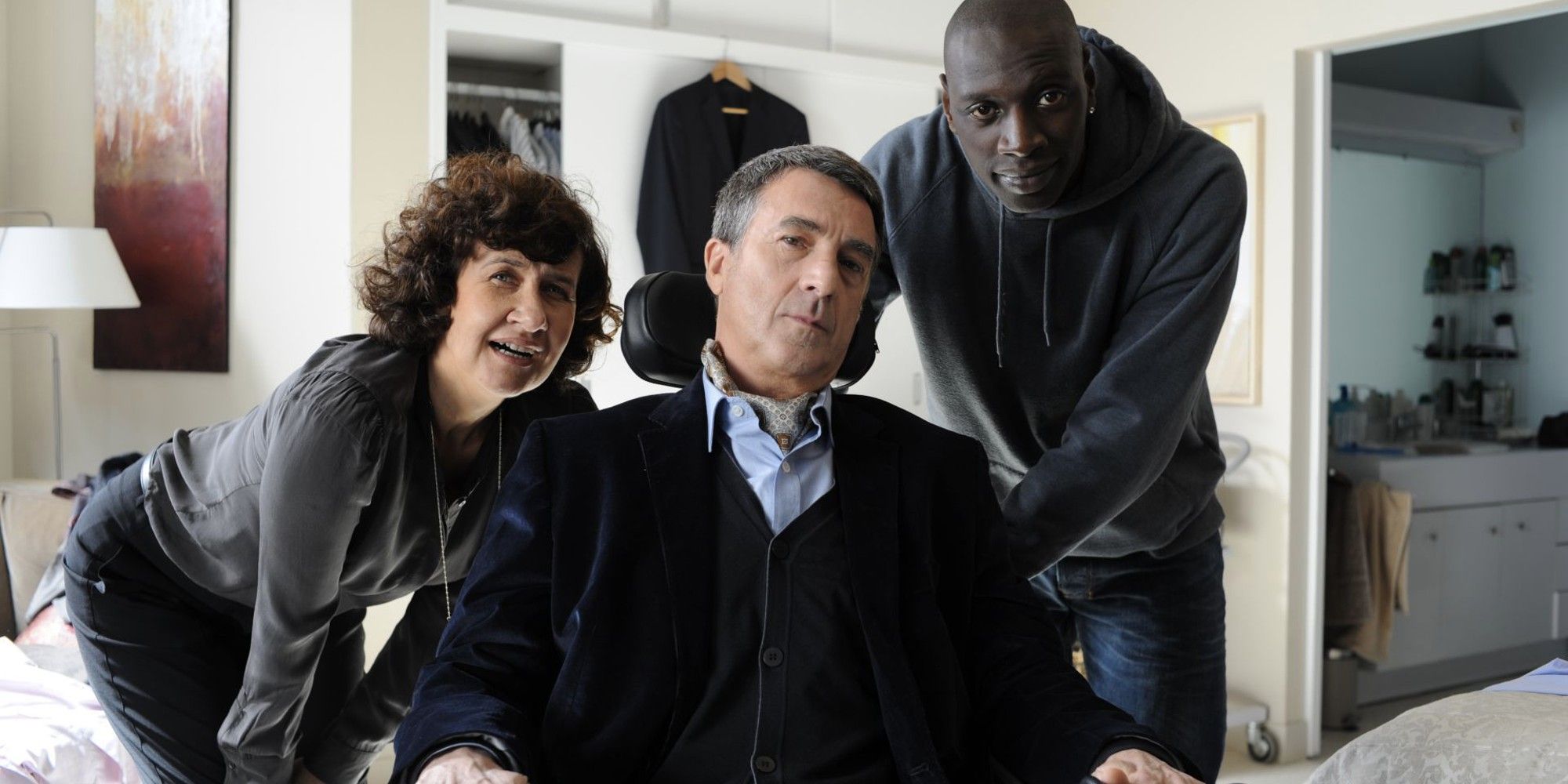 François Cluzet, Anne Le Ny, and Omar Sy in 'Intouchables'