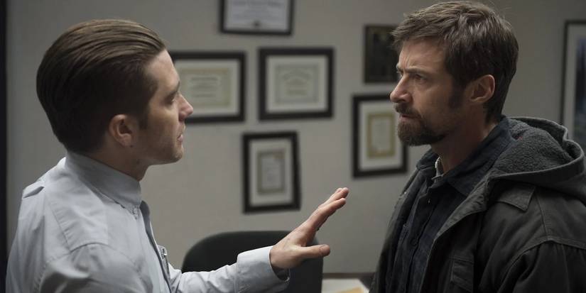 Jake Gyllenhaal as Loki attempts to calm Hugh Jackman as Keller down in 'Prisoners' (2013).