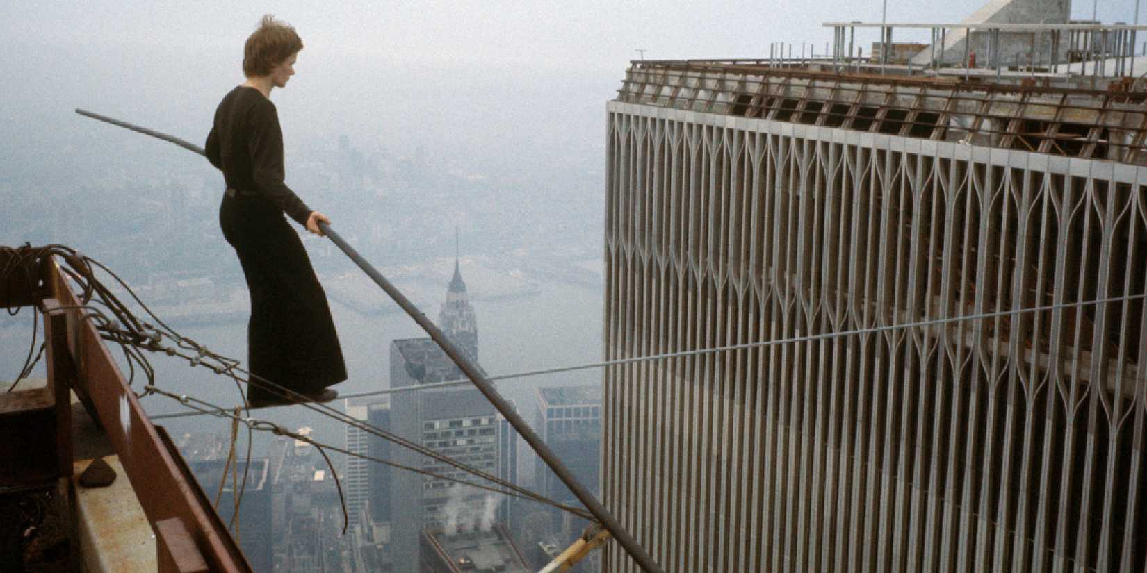 A man walking on a wire across two tall towers in Man on Wire - 2008