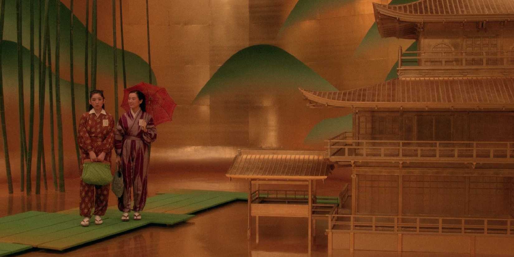 Two tiny women on a counter in Mishima A Life in Four Chapters