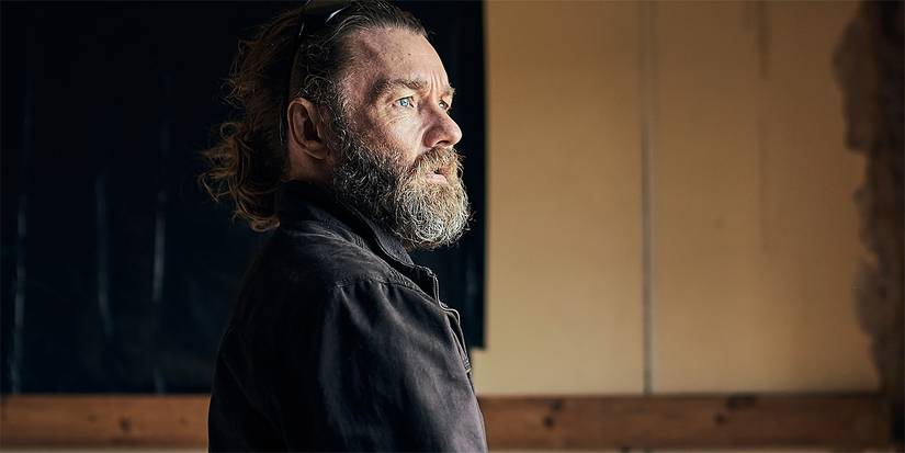 Joel Edgerton looks off at something in The Stranger Netflix Movie