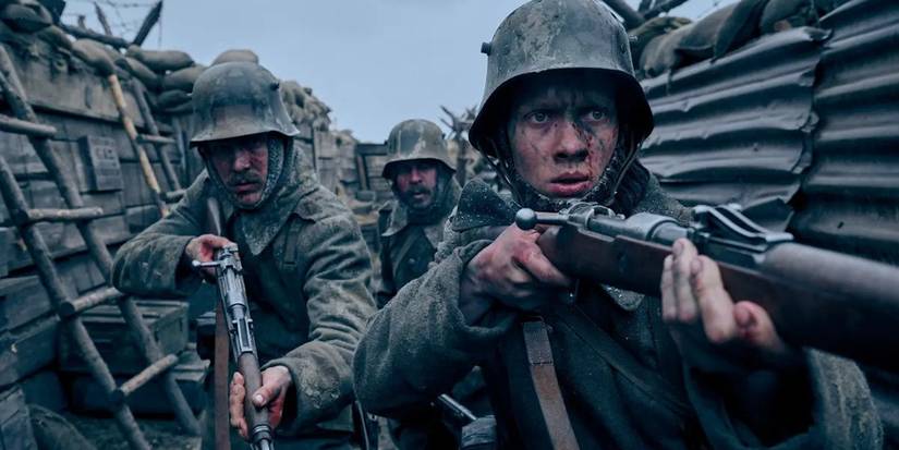 Three soldiers in the trenches in All Quiet on the Western Front