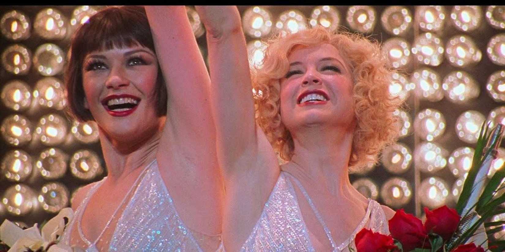 Velma and Roxie smiling on stage in Chicago