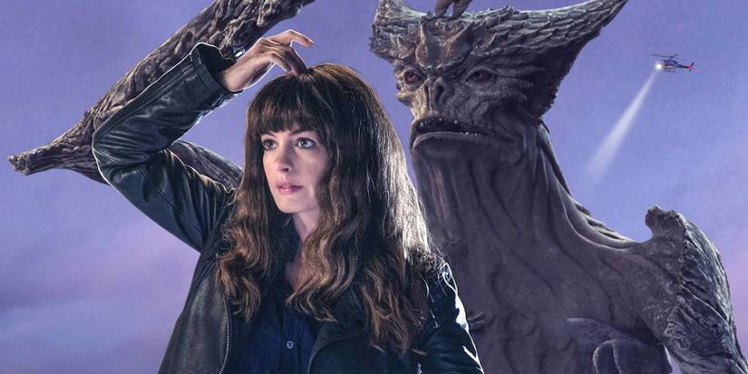 Anne Hathaway as Gloria scratching her head with the monster behind her doing the same in Colossal