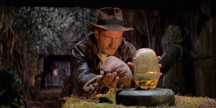 Harrison Ford as Indiana Jones snatches the idol in Raiders of the Lost Ark.