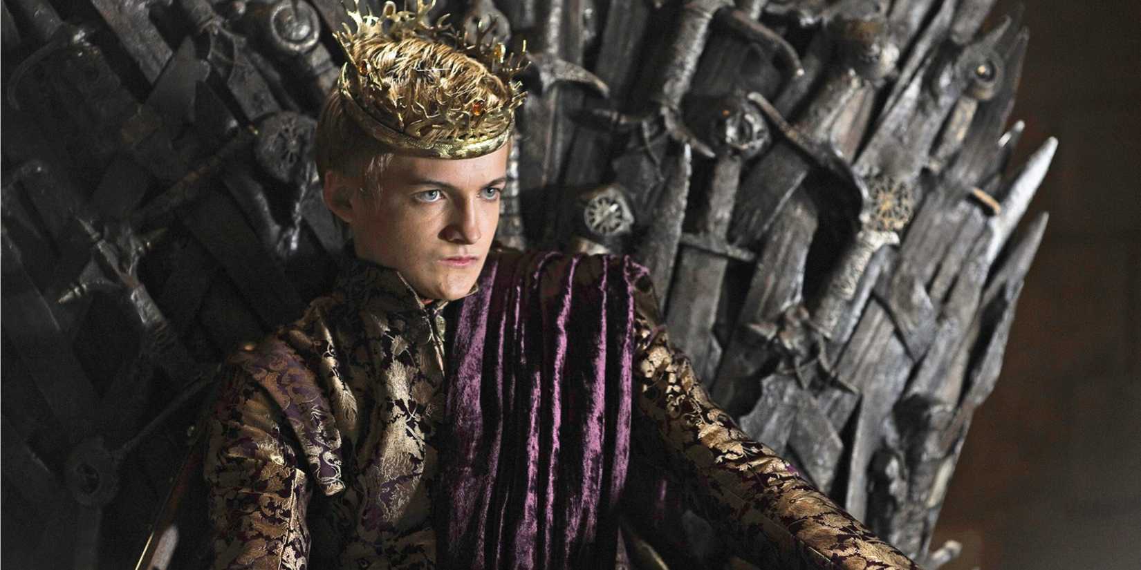 Joffrey with a crown and royal garments, sitting on the Iron Throne