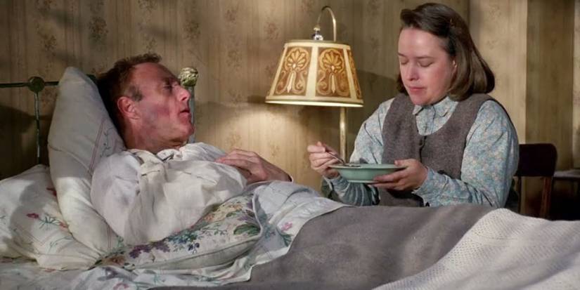 Annie feeds Paul by his bedside
